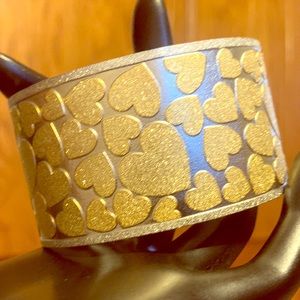 Gold plated hearts on stainless steel cuff
